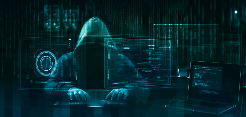 Hooded figure operating internet scam